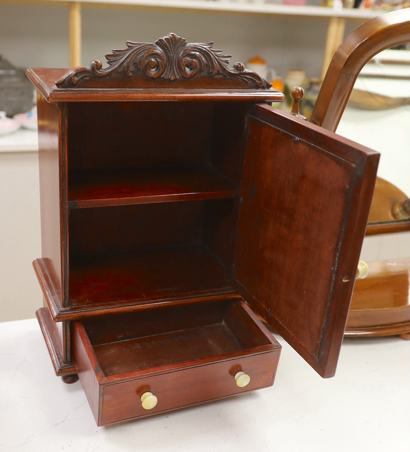 A Victorian mahogany dressing/toilet mirror and a smaller mirrored, one drawer, china handled cabinet, cabinet 47cm high, 30cm wide